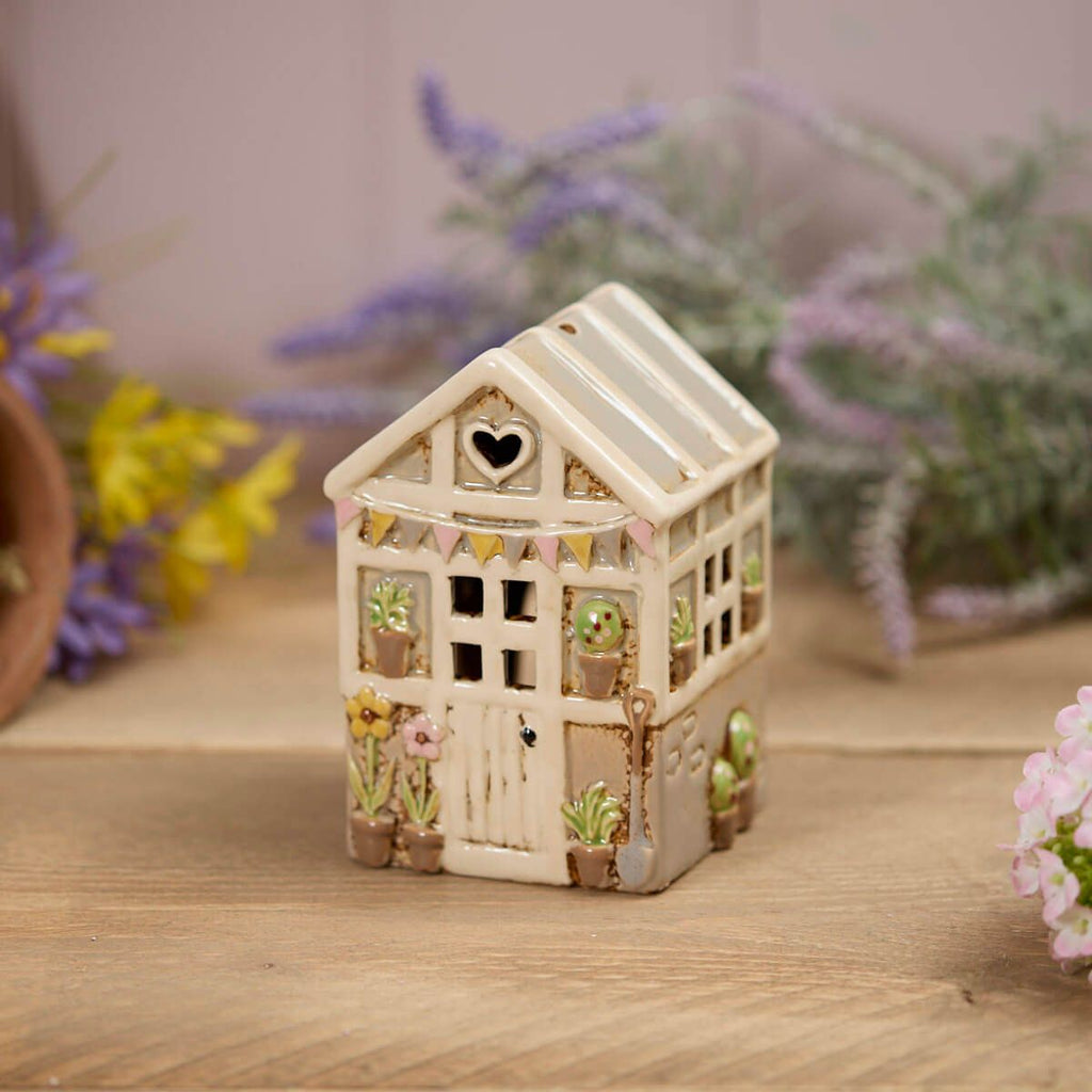 Stoneware green house tea light holder