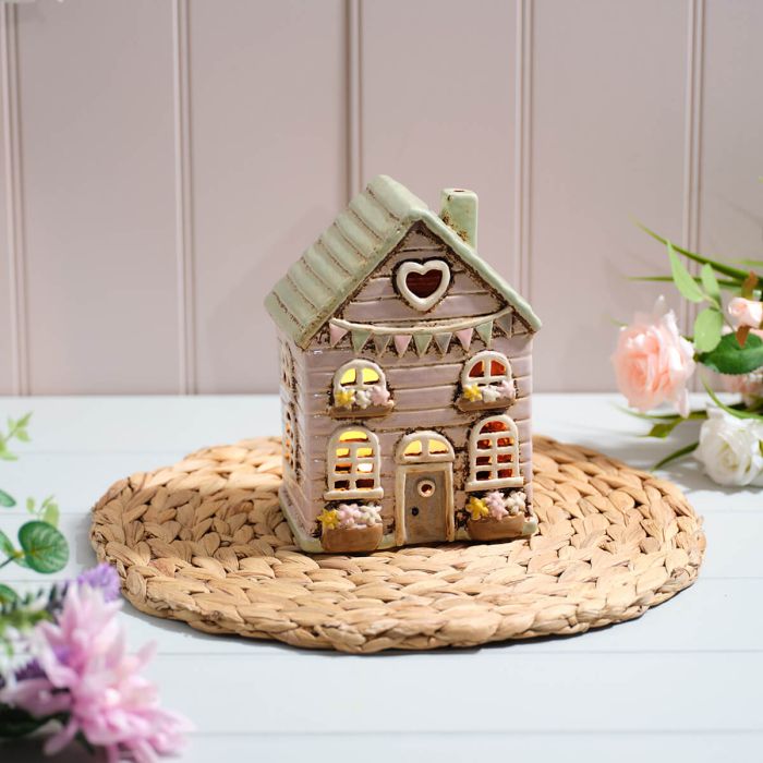 Stoneware house with bunting and flowers tealight holder