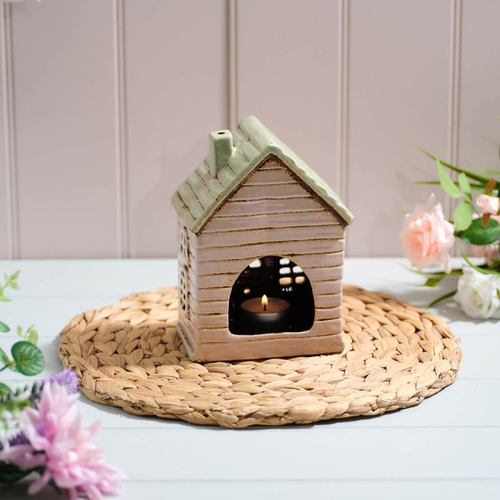 Stoneware house with bunting and flowers tealight holder