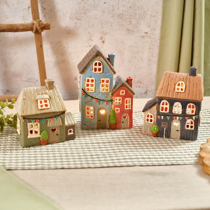 Stoneware sage green tealight house with bunting
