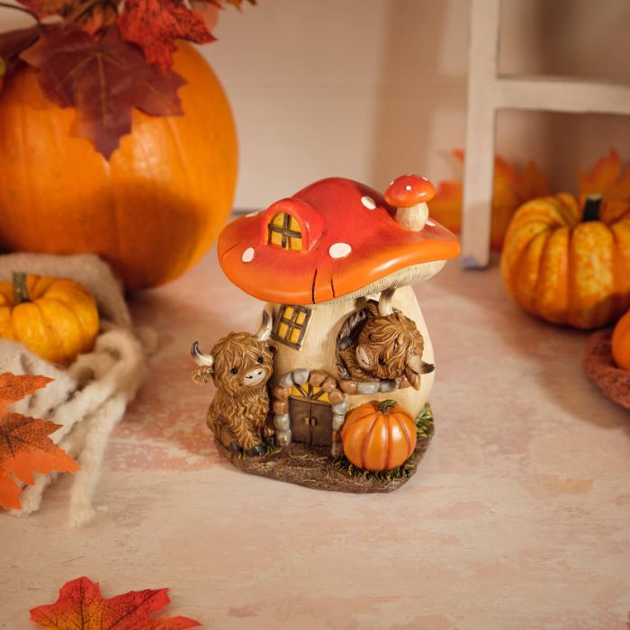 Harvest home toadstool and highland cow ornament