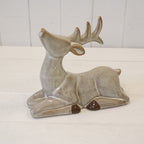 Sitting brown ceramic reindeer