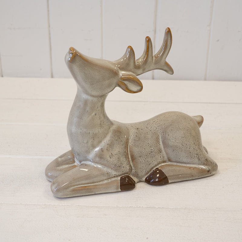 Sitting brown ceramic reindeer