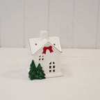 Medium Christmas house with red bow and trees - H 12cm