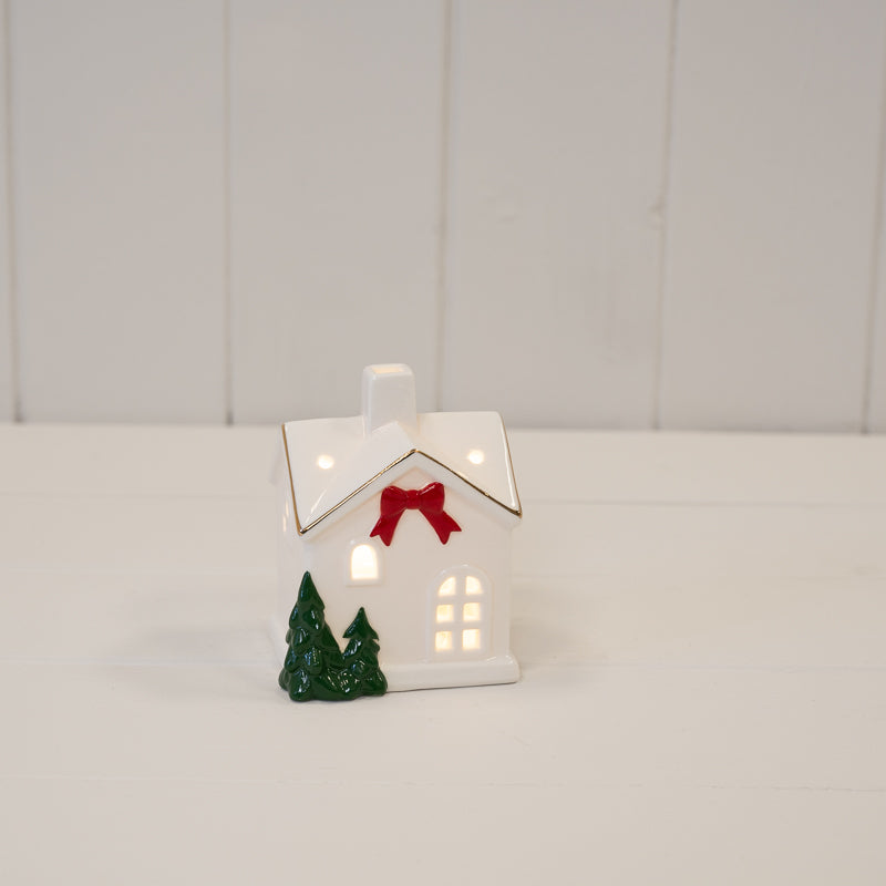 Small Christmas house with red bow and trees - H 9cm