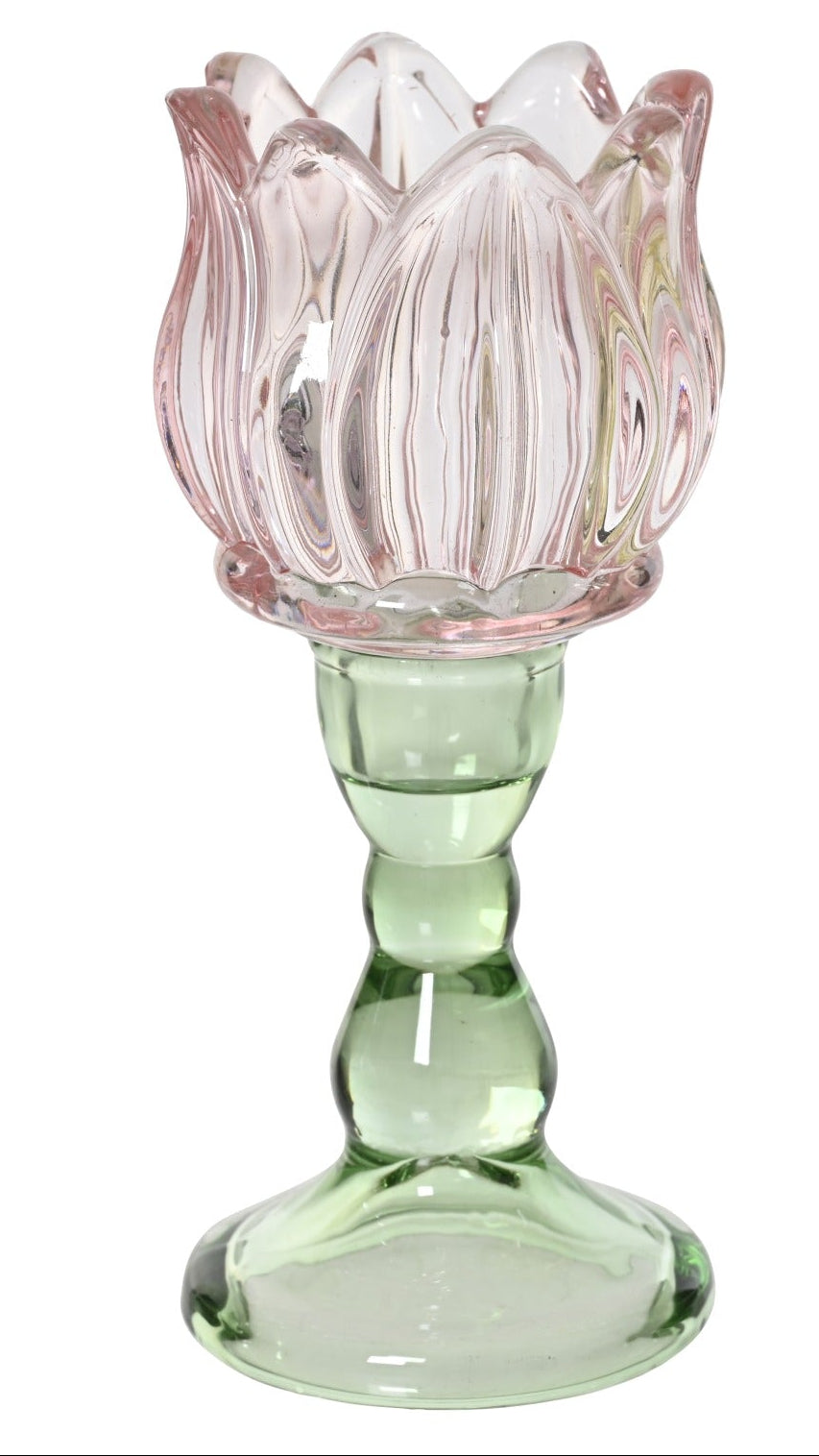 Three colorful glass candle holders shaped like lotus flowers on a white background