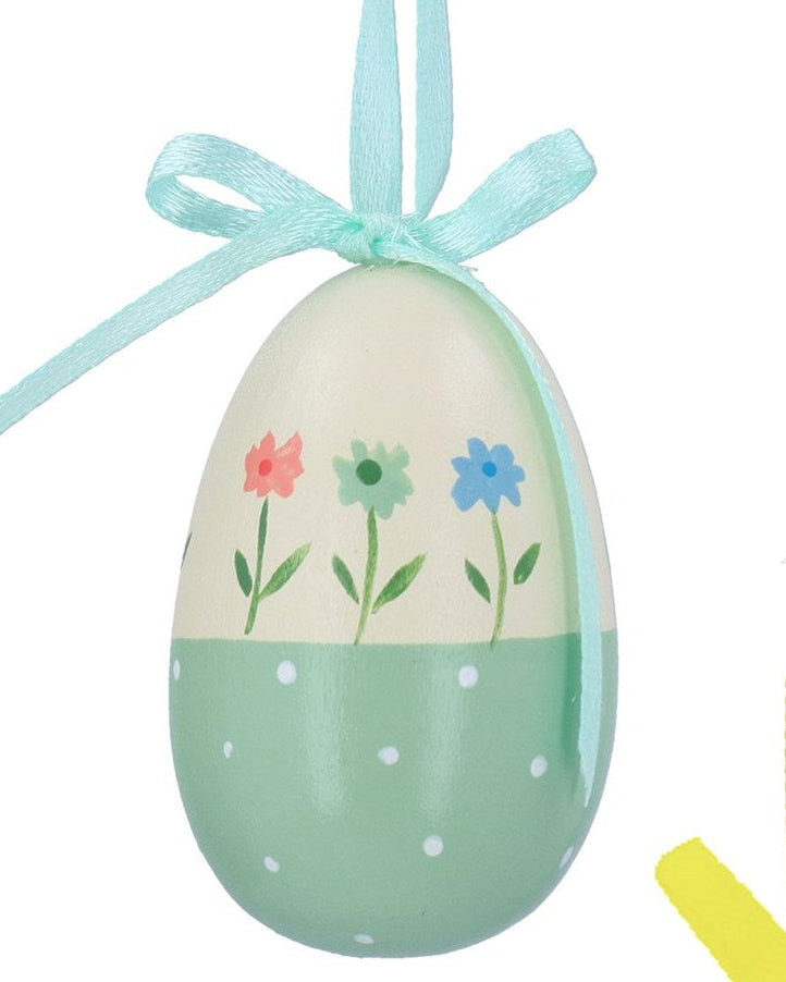 Three colorful Easter egg ornaments with floral designs and ribbons on a white background