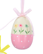 Three colorful Easter egg ornaments with floral designs and ribbons on a white background