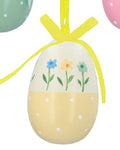 Three colorful Easter egg ornaments with floral designs and ribbons on a white background