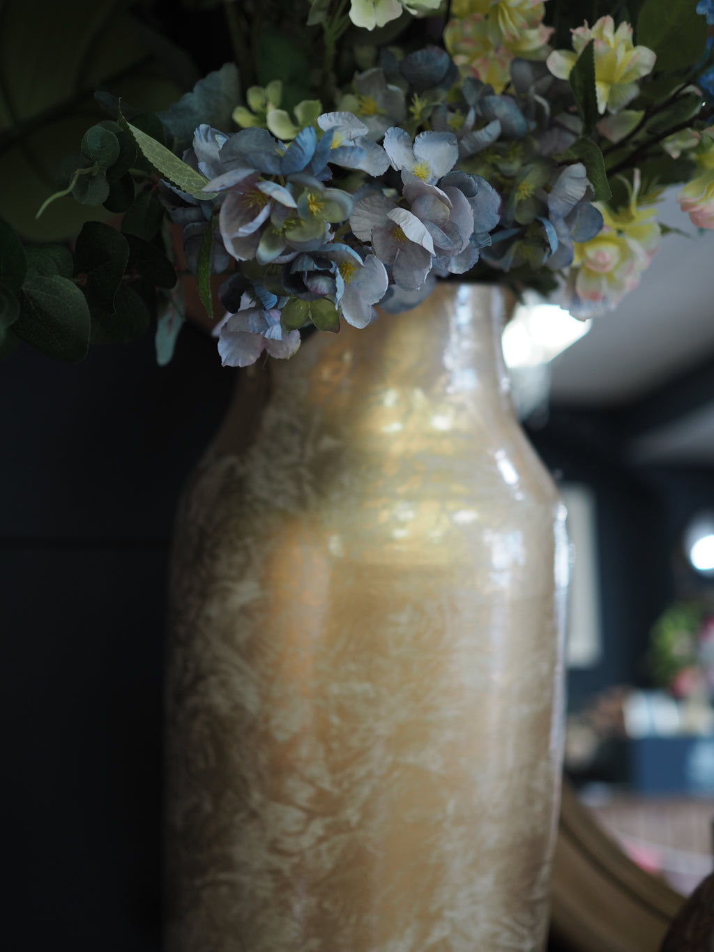 Gold glazed vase with mottled effect