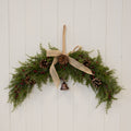 Red berry & pinecone swag with bell and bow
