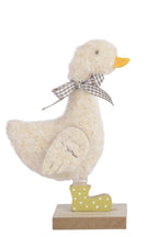 Two decorative duck figurines on stands with a white background