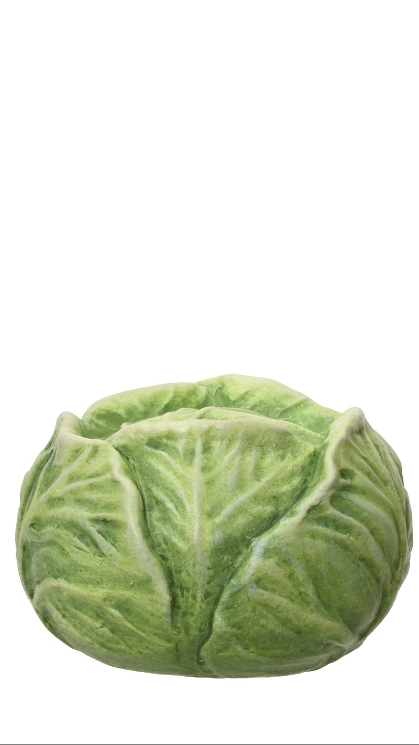 Three ceramic vegetable sculptures on a white background