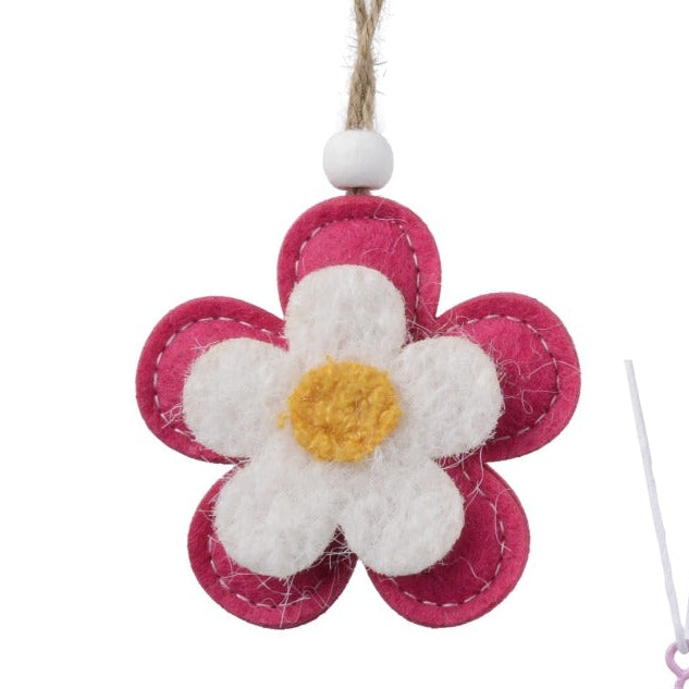 Set of colorful Easter-themed decorations including bunnies, eggs, and flowers on a white background.
