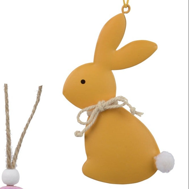 Set of colorful Easter-themed decorations including bunnies, eggs, and flowers on a white background.