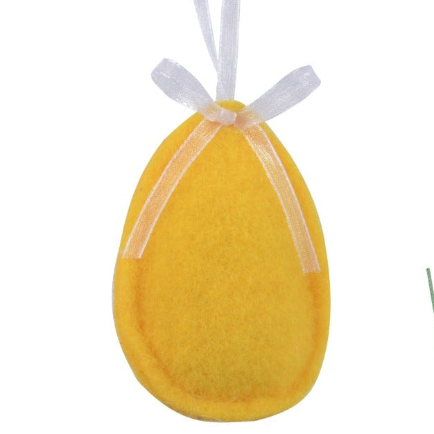 Set of colorful Easter-themed decorations including bunnies, eggs, and flowers on a white background.