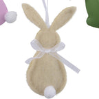 Set of colorful Easter-themed decorations including bunnies, eggs, and flowers on a white background.