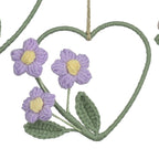 Set of four heart-shaped floral decorations with colorful flowers on a white background