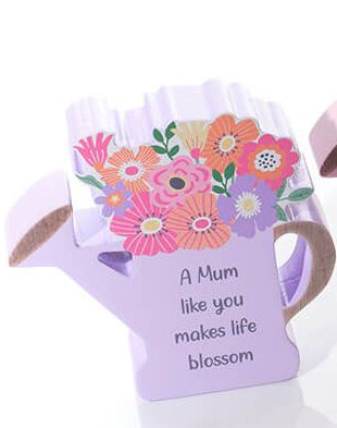 Wooden watering can with flowers
