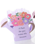 Wooden watering can with flowers