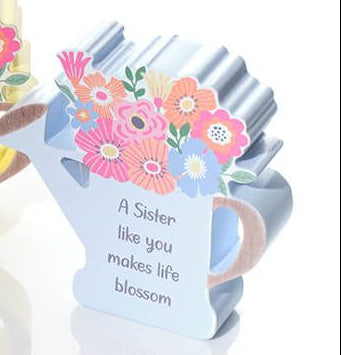 Wooden watering can with flowers