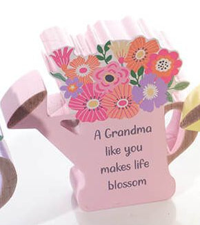 Wooden watering can with flowers