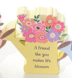 Wooden watering can with flowers