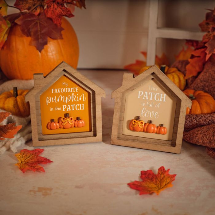 Wooden framed house-shaped plaque