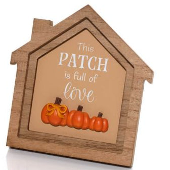 Wooden framed house-shaped plaque