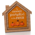 Wooden framed house-shaped plaque