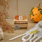 Wooden pumpkin cart ornament with pumpkins and bunting