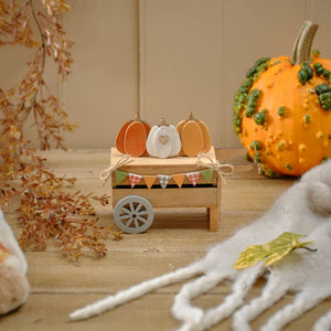 Wooden pumpkin cart ornament with pumpkins and bunting