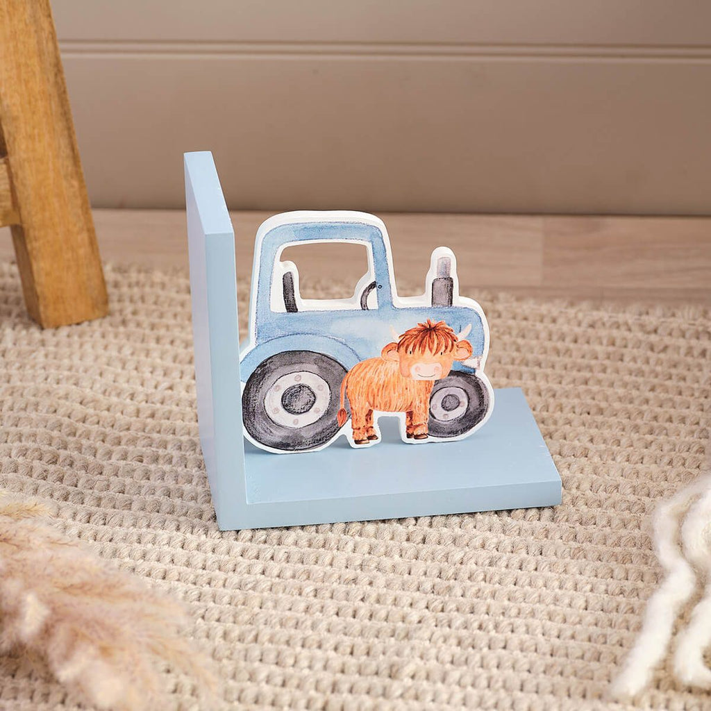Monty highland cow tractor bookend