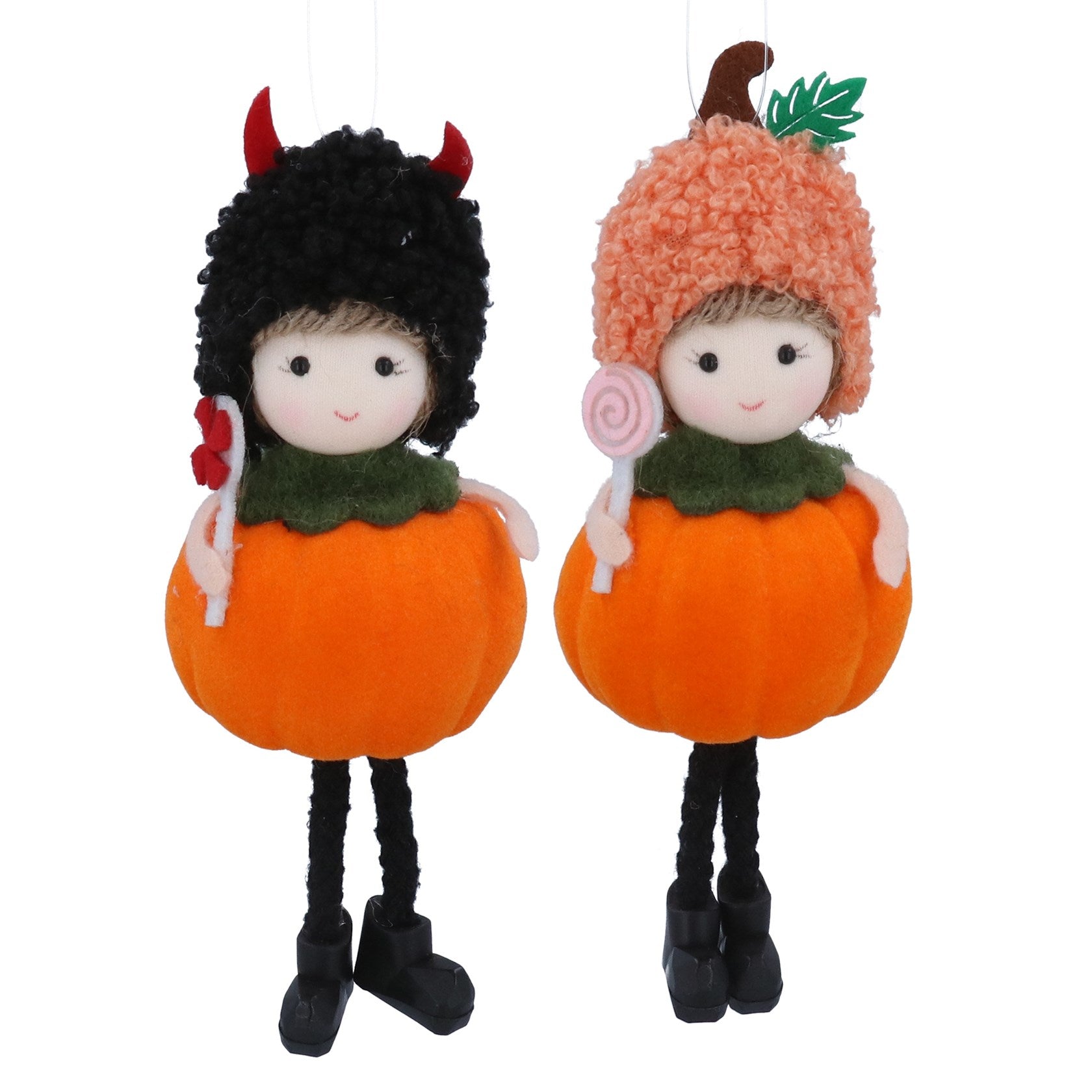 Cute little girl in pumpkin costume hanging dec