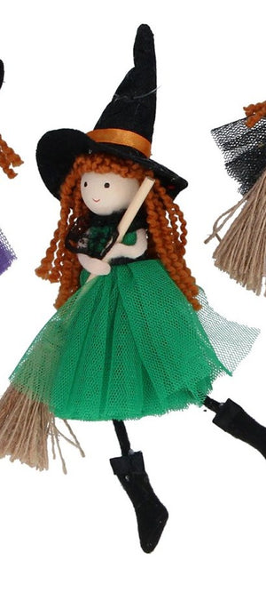 Witch with broom decorations