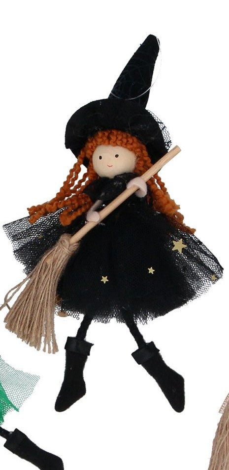 Witch with broom decorations