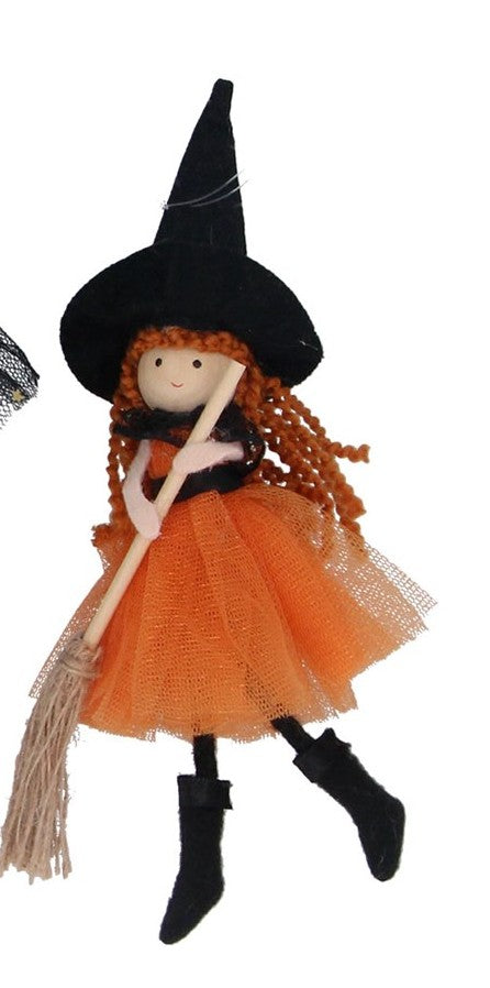 Witch with broom decorations