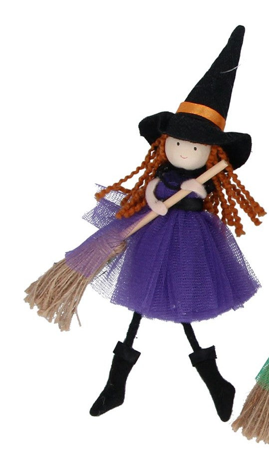 Witch with broom decorations