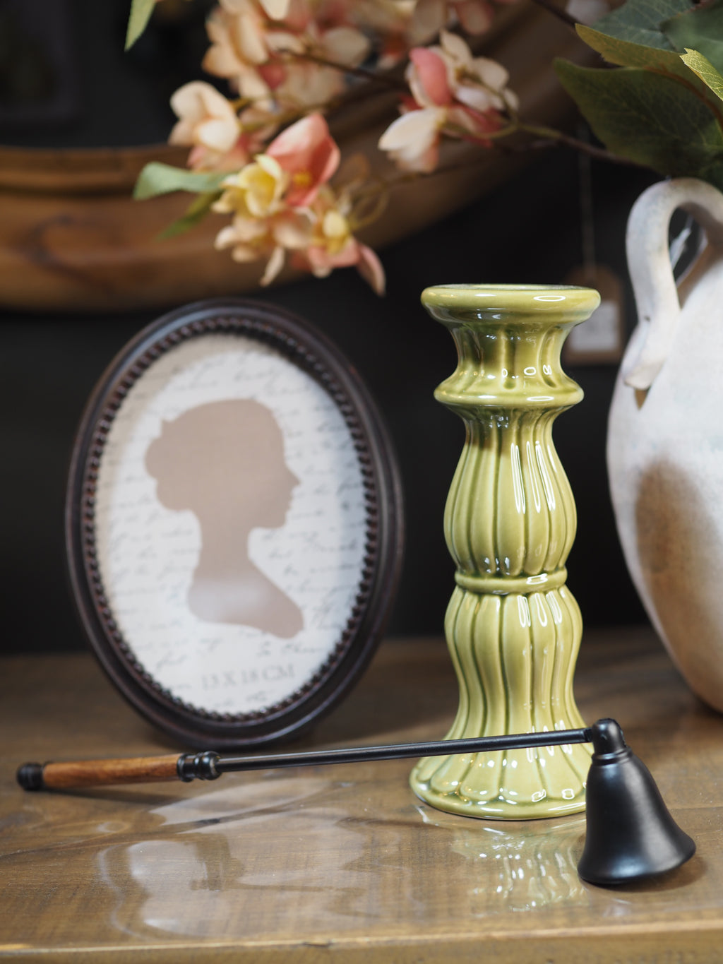 Black candle snuffer with wooden handles
