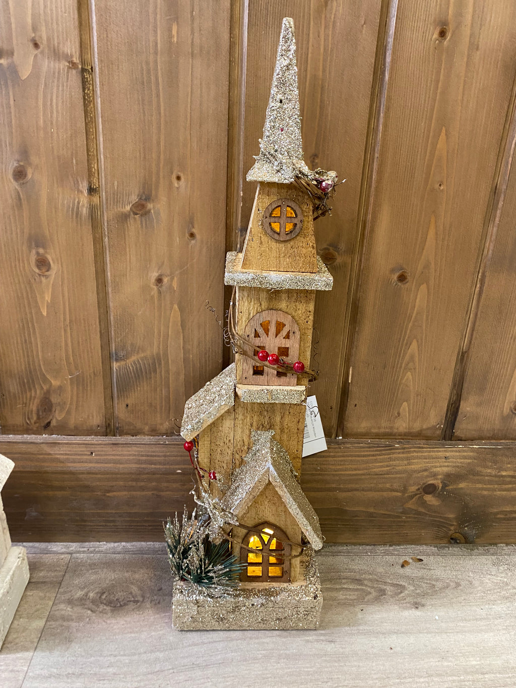 Tall wooden light up church with gold sparkle