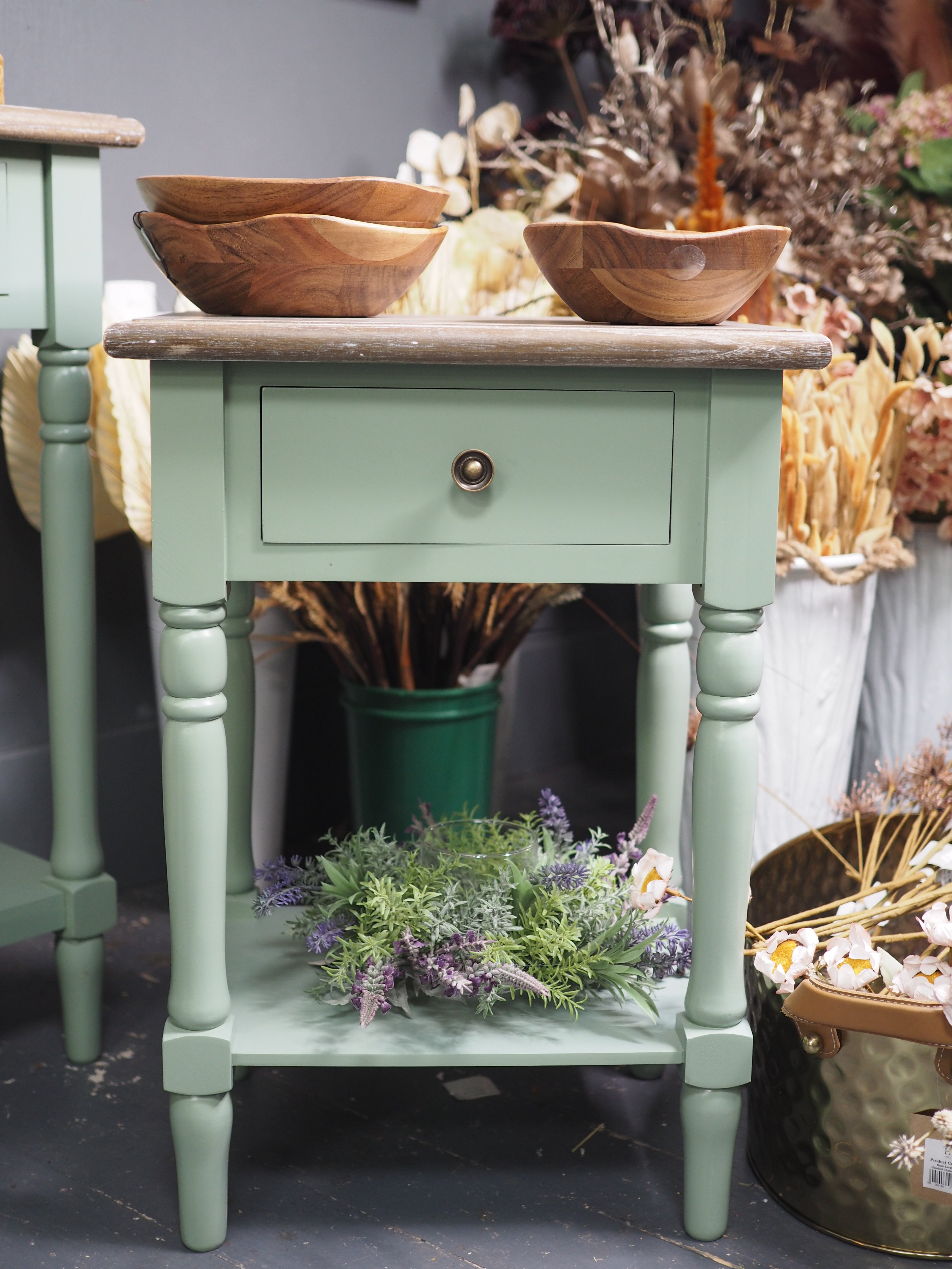 Green side table with shelf display