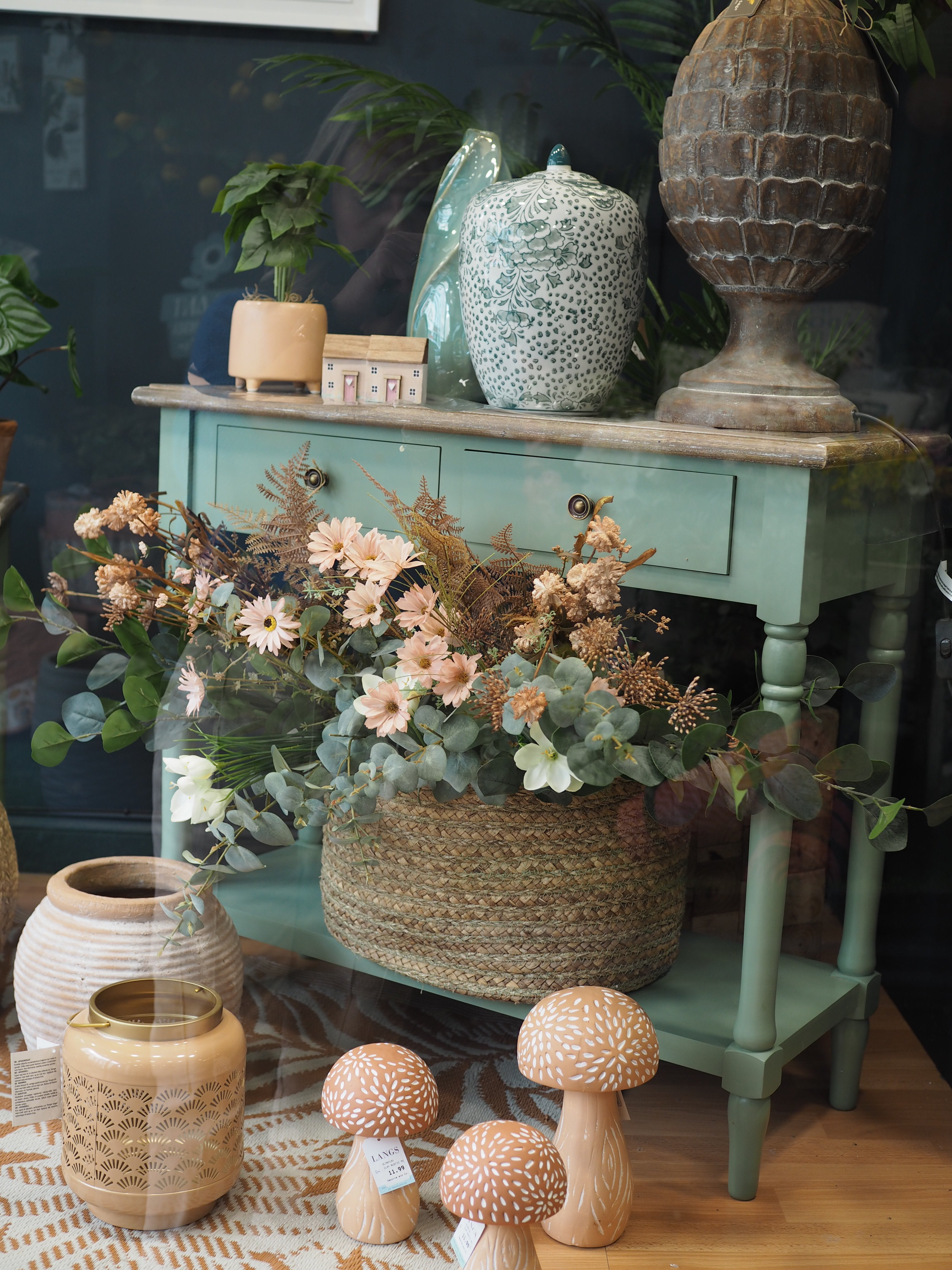 Two drawer green console table with shelf