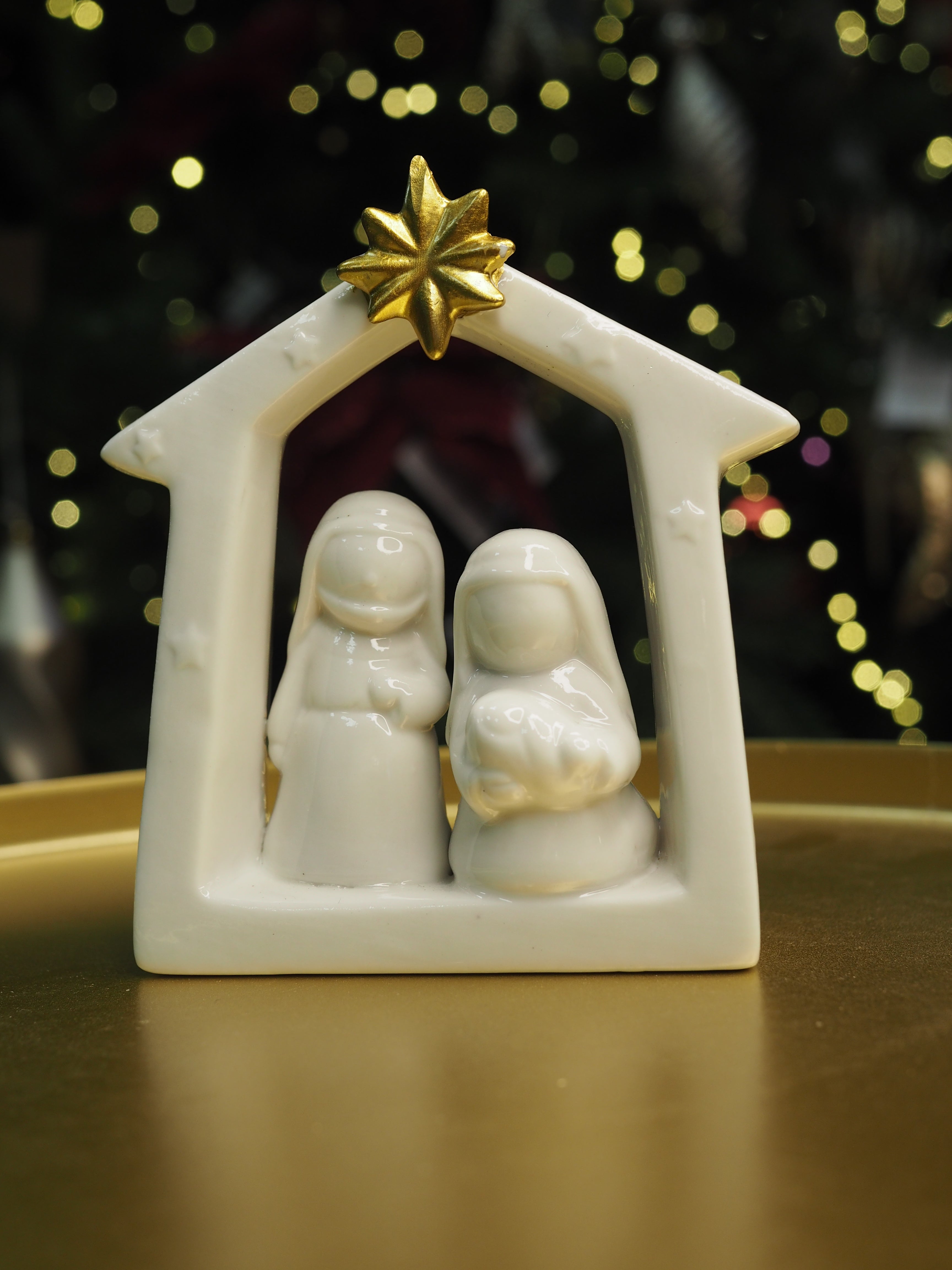 Small white ceramic nativity with gold star