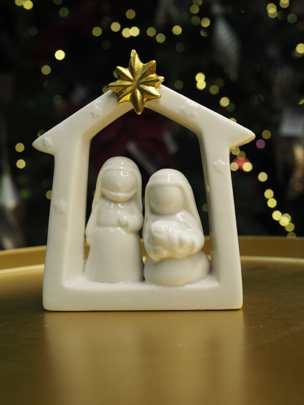 Small white ceramic nativity with gold star