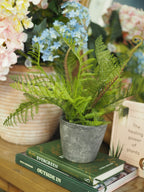 Faux fern with tendrils in pot