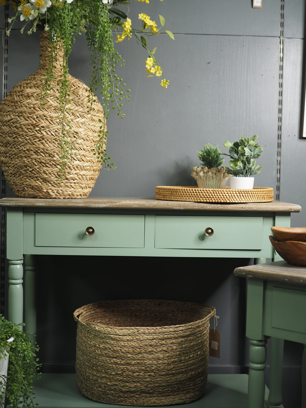 Two drawer green console table with shelf