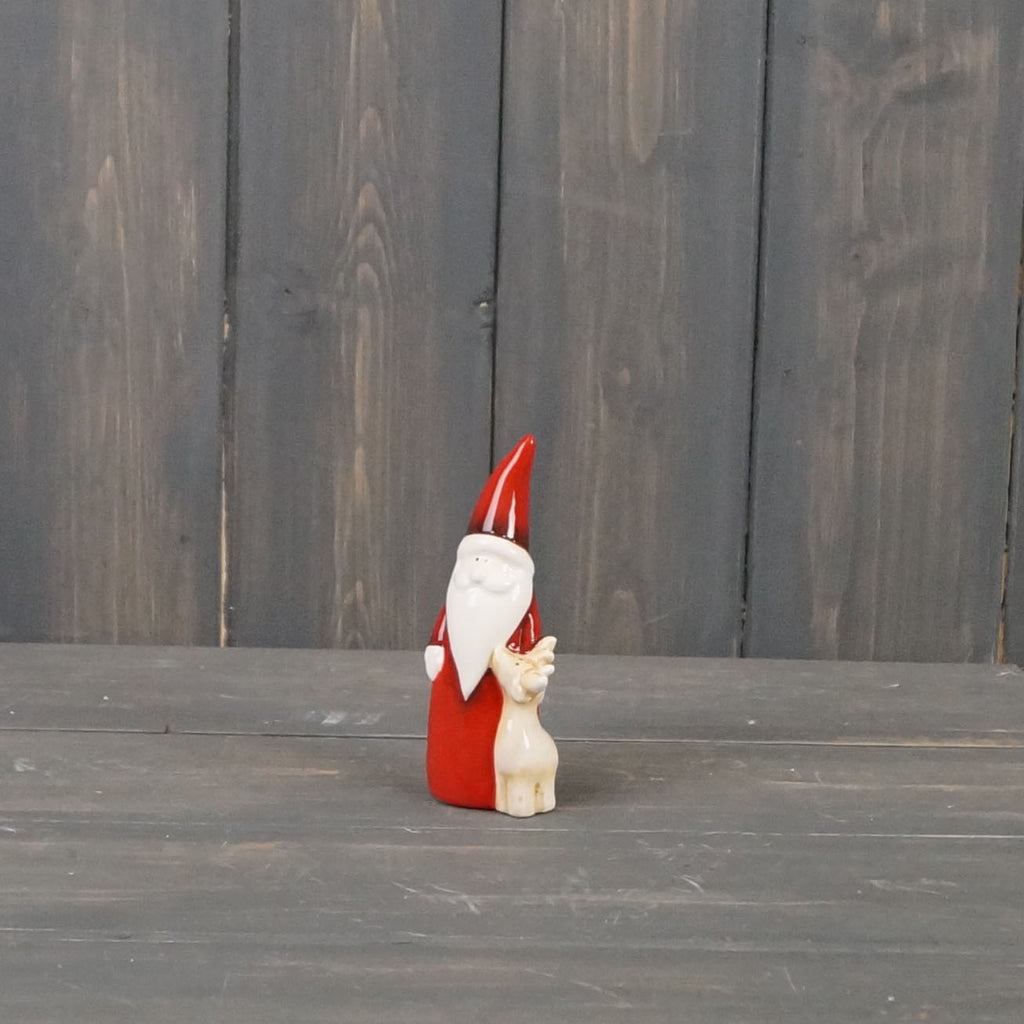 Red ceramic Santa with reindeer ornament