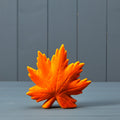 Flocked ceramic maple leaf ornament in bright orange