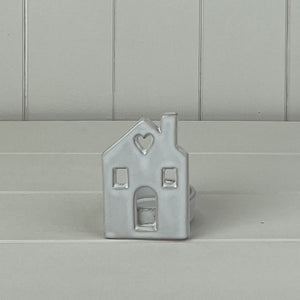 Quirky off white ceramic house tealight holder with heart window