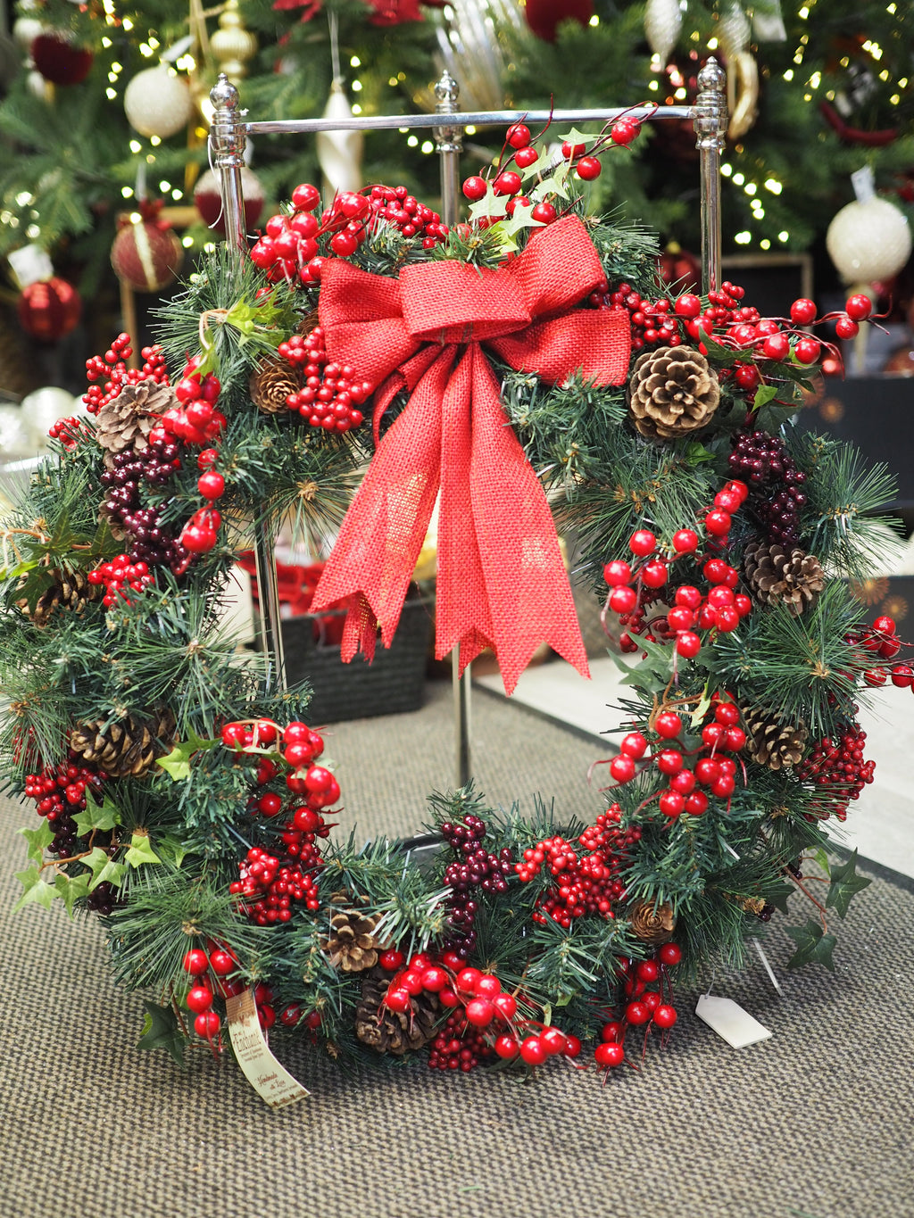 Traditional Christmas wreath with red berries and bow - large